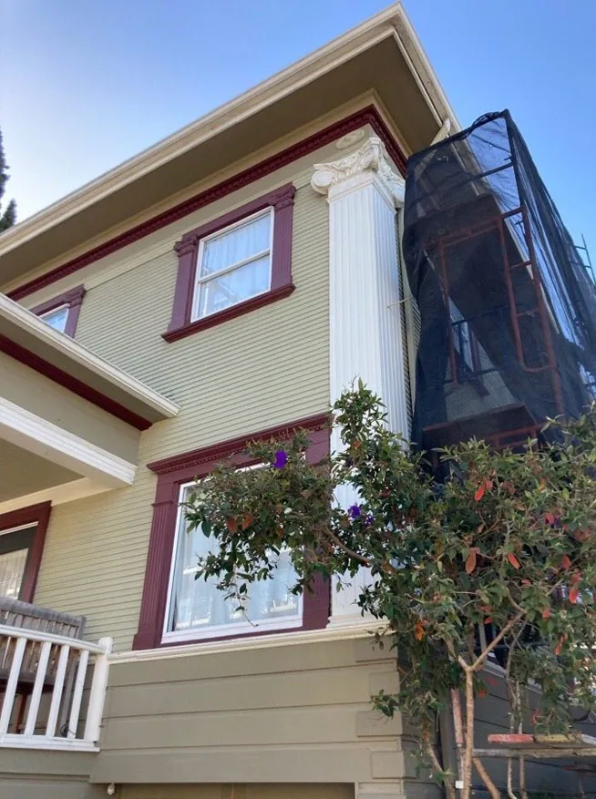 Huntington Beach Scaffolding installation with safety netting on historic residential property for exterior restoration